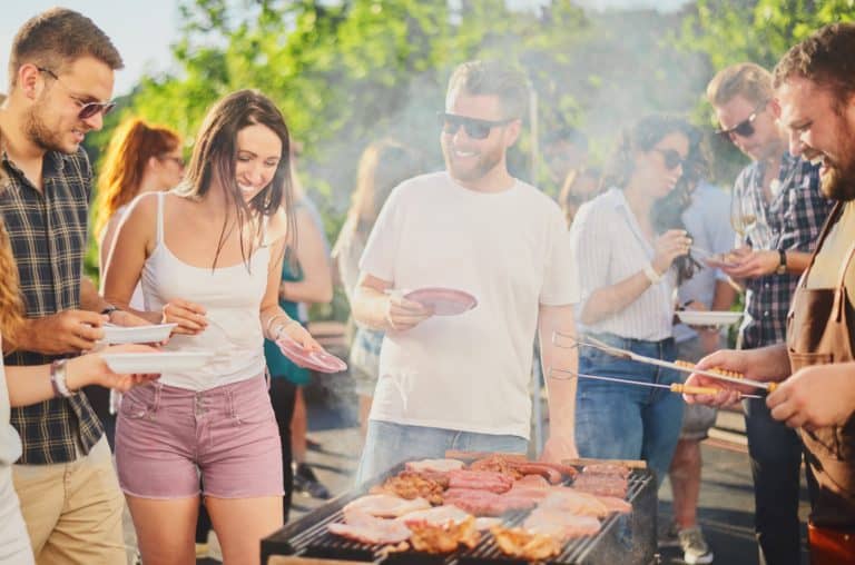group of friends throwing a BBQ party